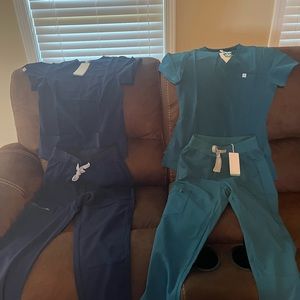 2 extra small scrub sets new with tags